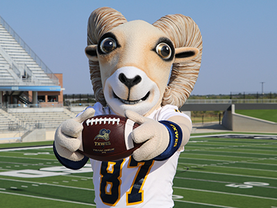  Texas Wesleyan mascot, Willie, holding a football
